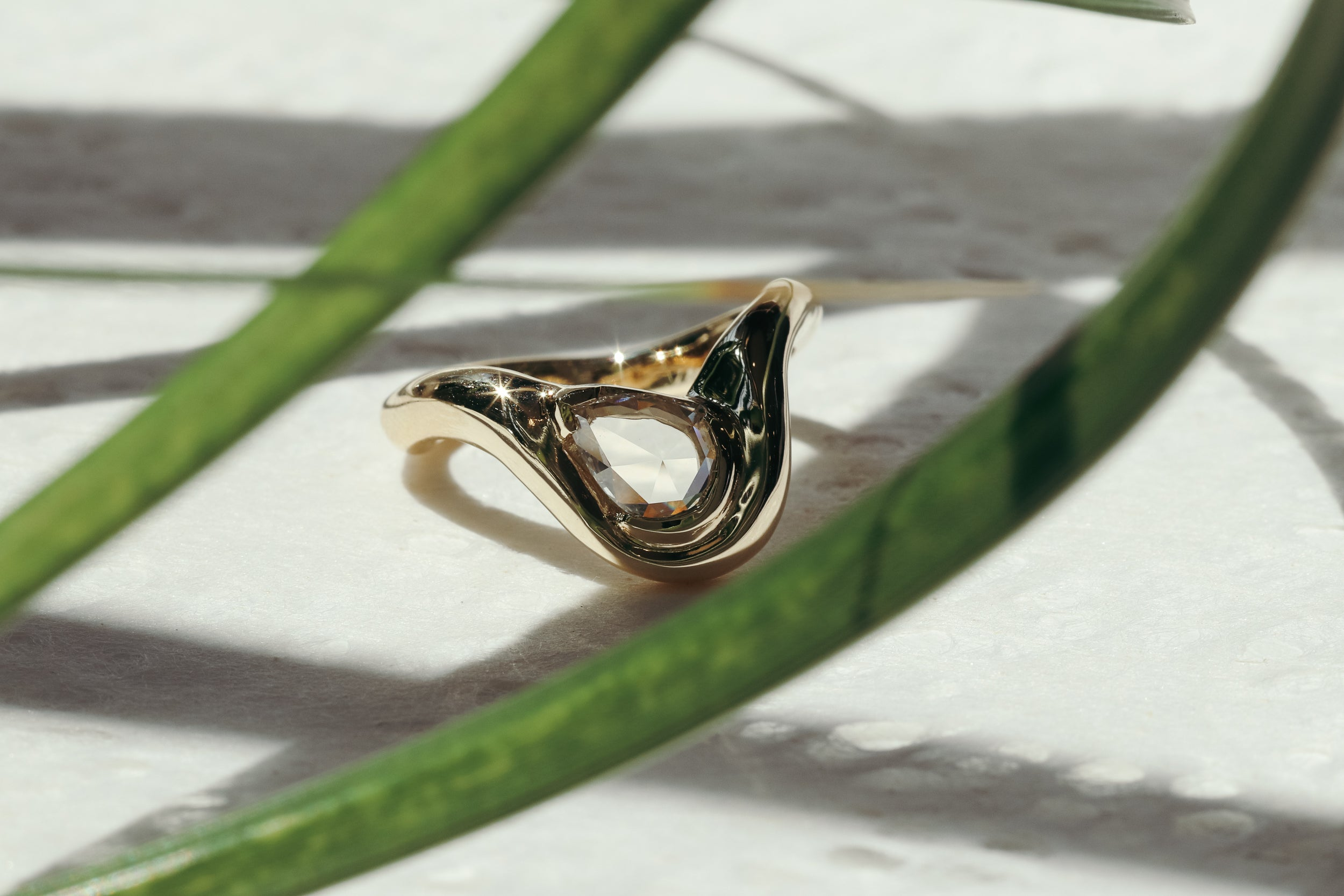 Lifestyle shot of the Pear Dip Ring in 14k yellow gold by Kestrel Dillon