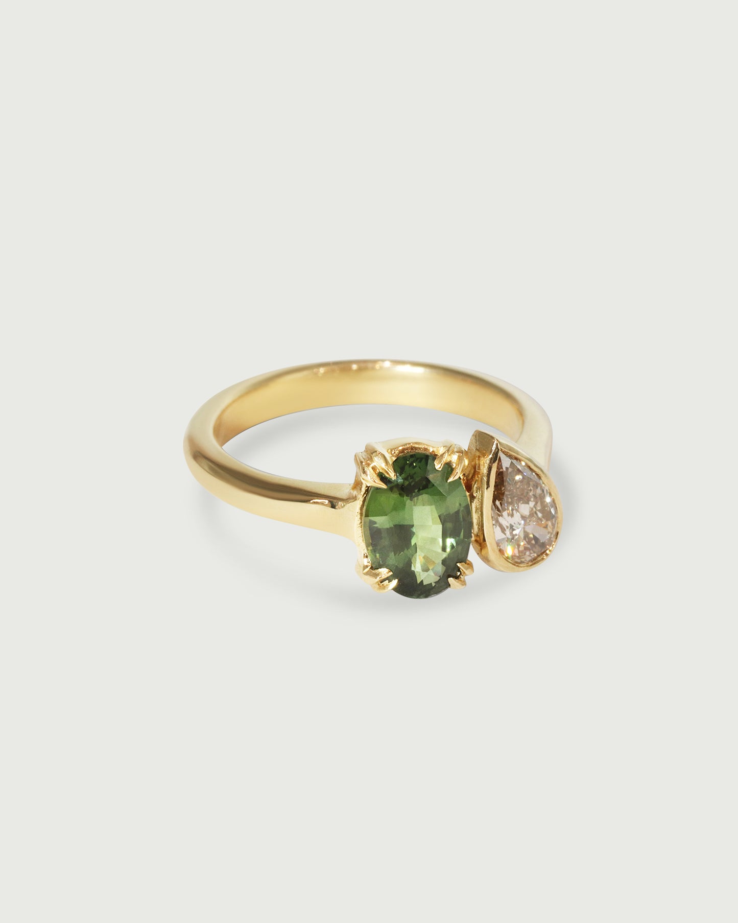 Side view of Oval & Pear Toi et Moi Ring in 18k yellow gold Side view of Oval & Pear Toi et Moi Ring in 18k yellow gold