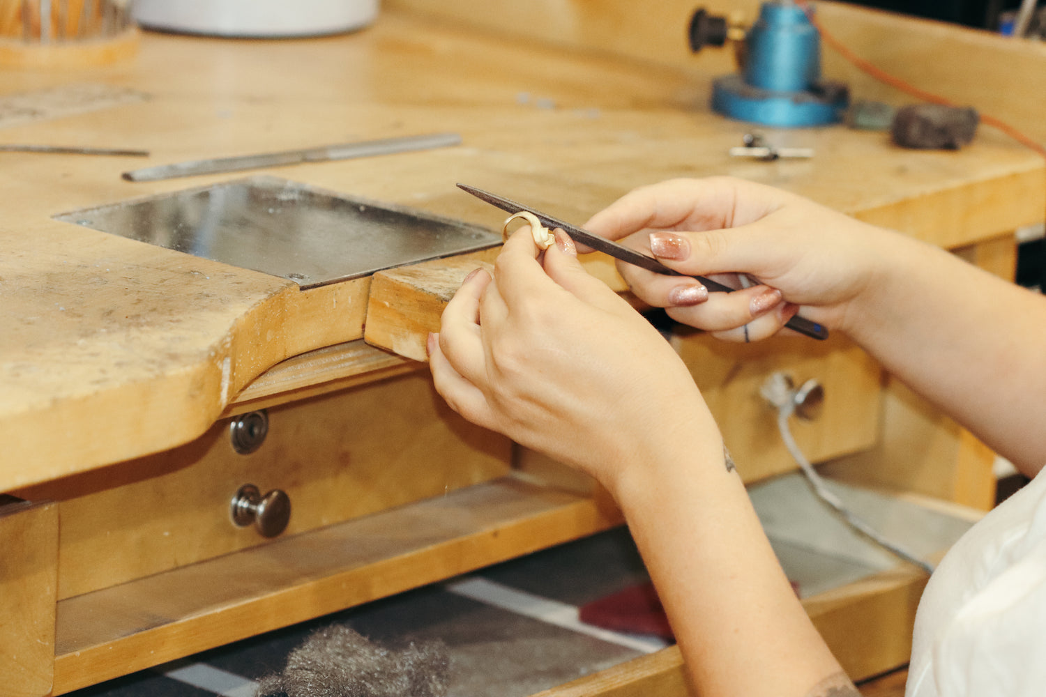 Kestrel Dillon working on a custom ring at her bench