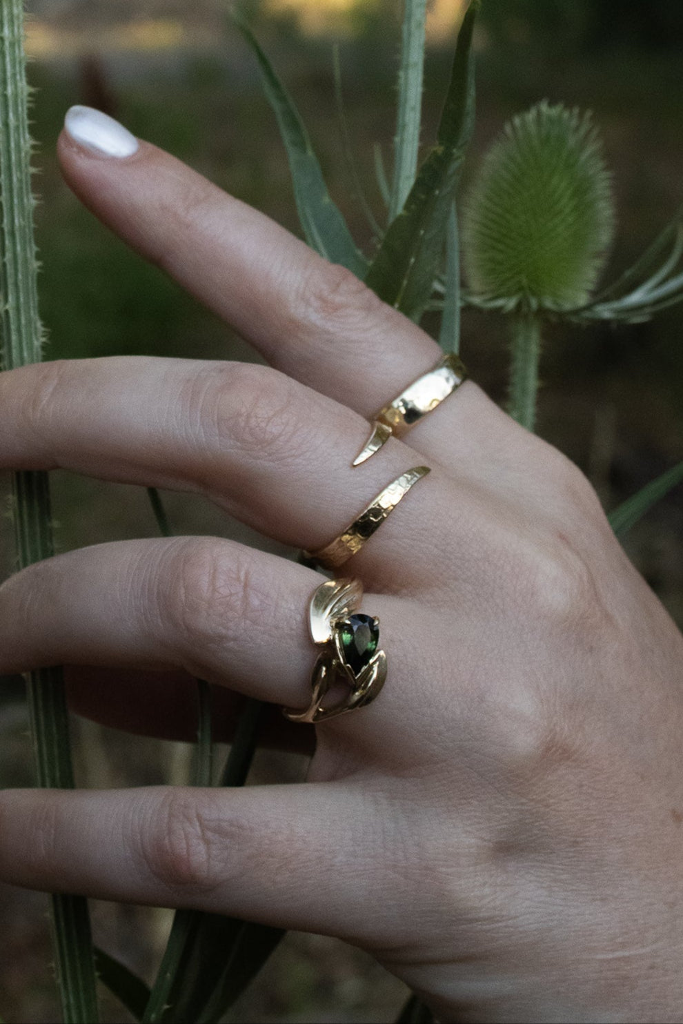 Model wears Curved Willow Ring, Snake Spiral Ring, and 4.5mm Hammered Band by Kestrel Dillon Model wears Curved Willow Ring, Snake Spiral Ring, and 4.5mm Hammered Band by Kestrel Dillon