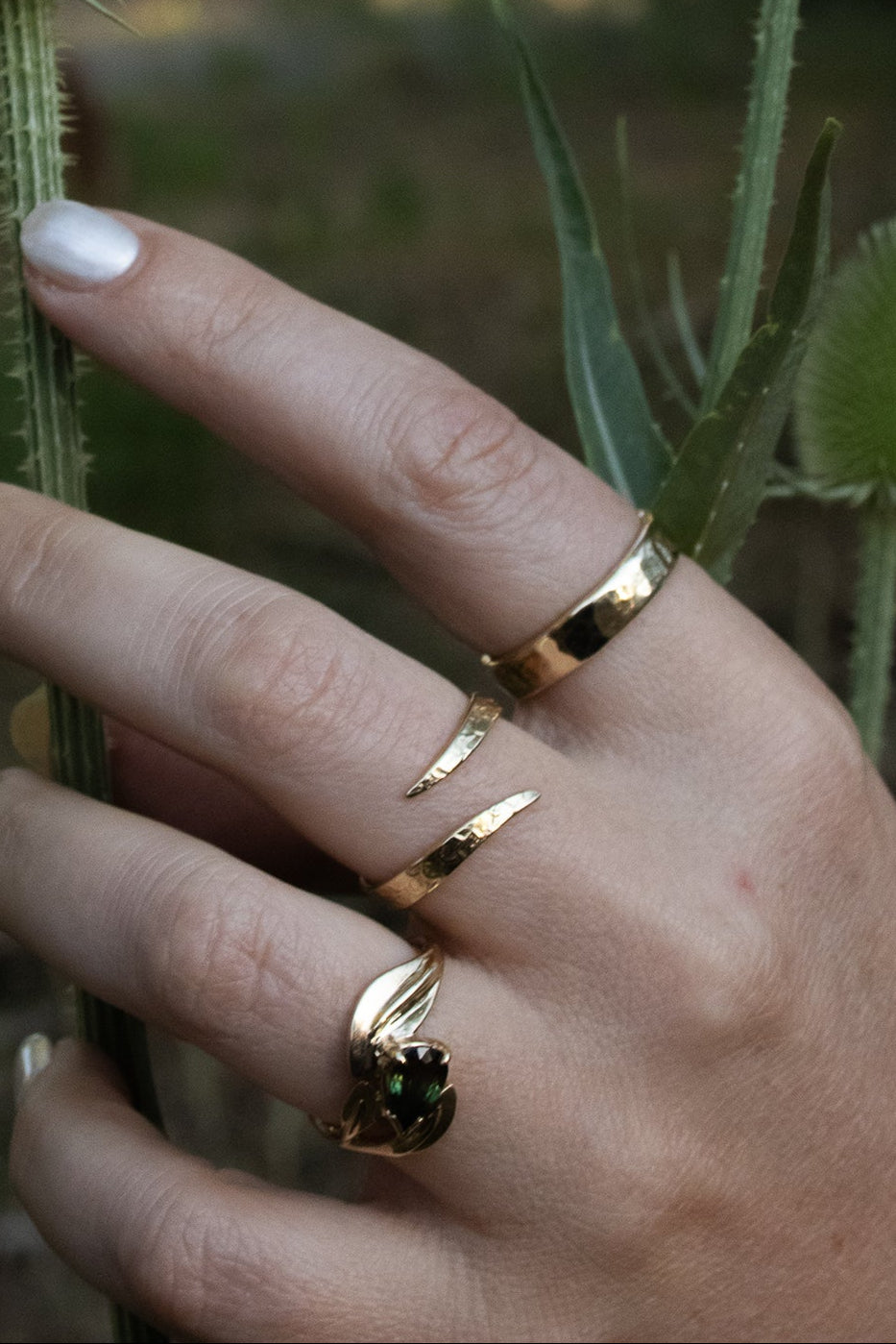 Model wears Curved Willow Ring, Snake Spiral Ring, and 4.5mm Hammered Band by Kestrel Dillon Model wears Curved Willow Ring, Snake Spiral Ring, and 4.5mm Hammered Band by Kestrel Dillon