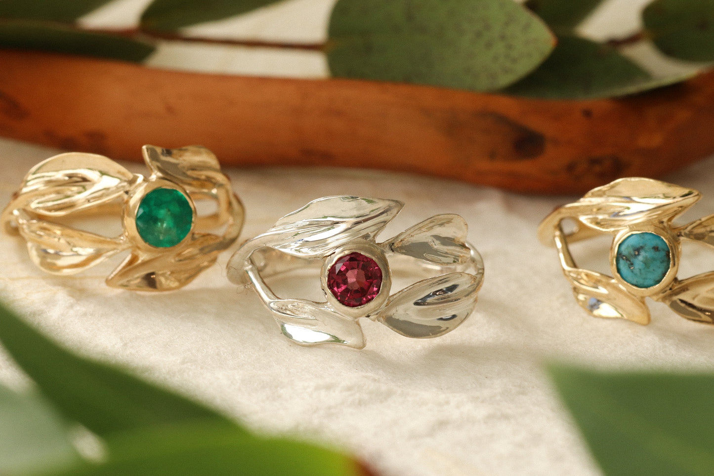 Group lifestyle shot of East / West Willow Ring, Garnet Willow Ring, and Emerald Willow Ring by Kestrel Dillon Group lifestyle shot of East / West Willow Ring, Garnet Willow Ring, and Emerald Willow Ring by Kestrel Dillon
