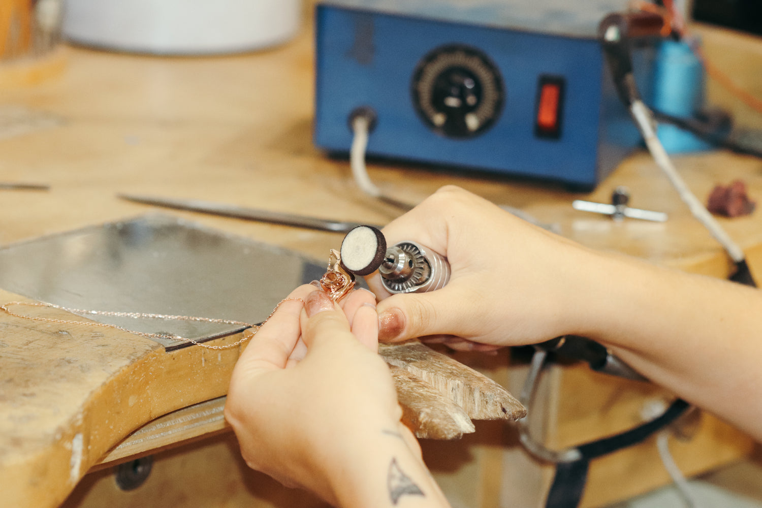 Kestrel Dillon working on a pendant at her studio