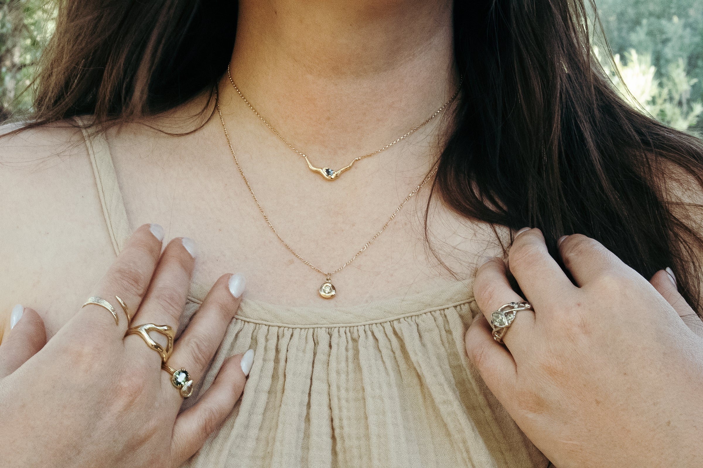 Model wears Pear Dip Necklace in 14k yellow gold and Star Jelly Pendant with Champagne Diamond by Kestrel Dillon