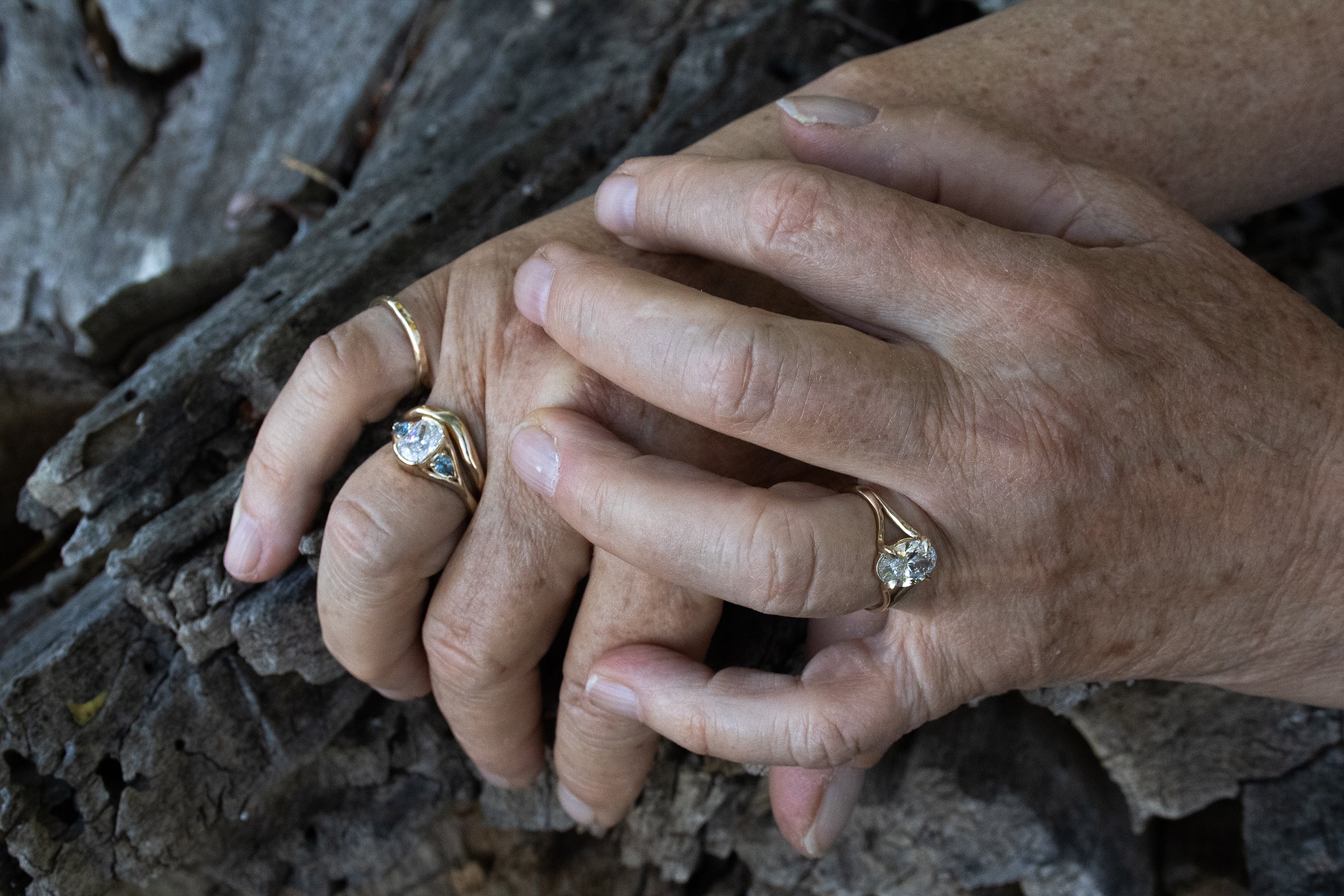 Model wears Triple Tributary Ring and Root Curve Diamond Band in 14k yellow gold, and Tributary Ring
by Kestrel Dillon