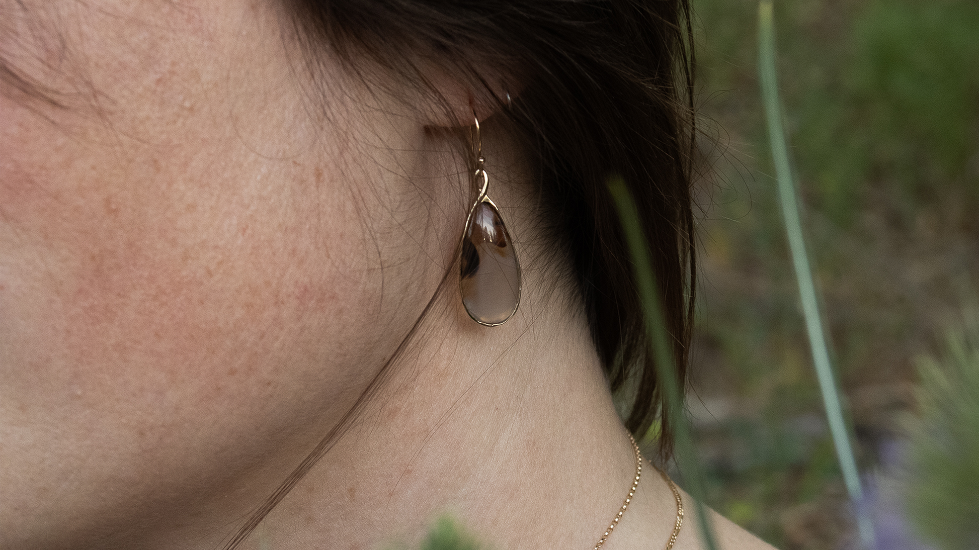 Model wears Montana Agate Earrings by Kestrel Dillon
