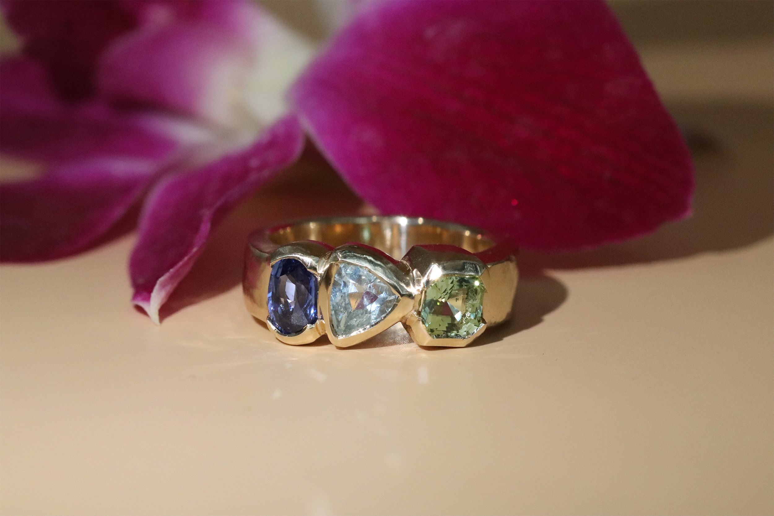 custom engagement ring by Kestrel Dillon featuring various gemstones